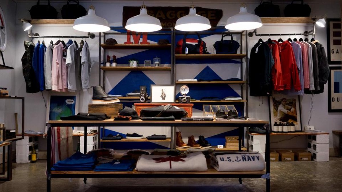 Retail store interior with jackets and apparel on shelves